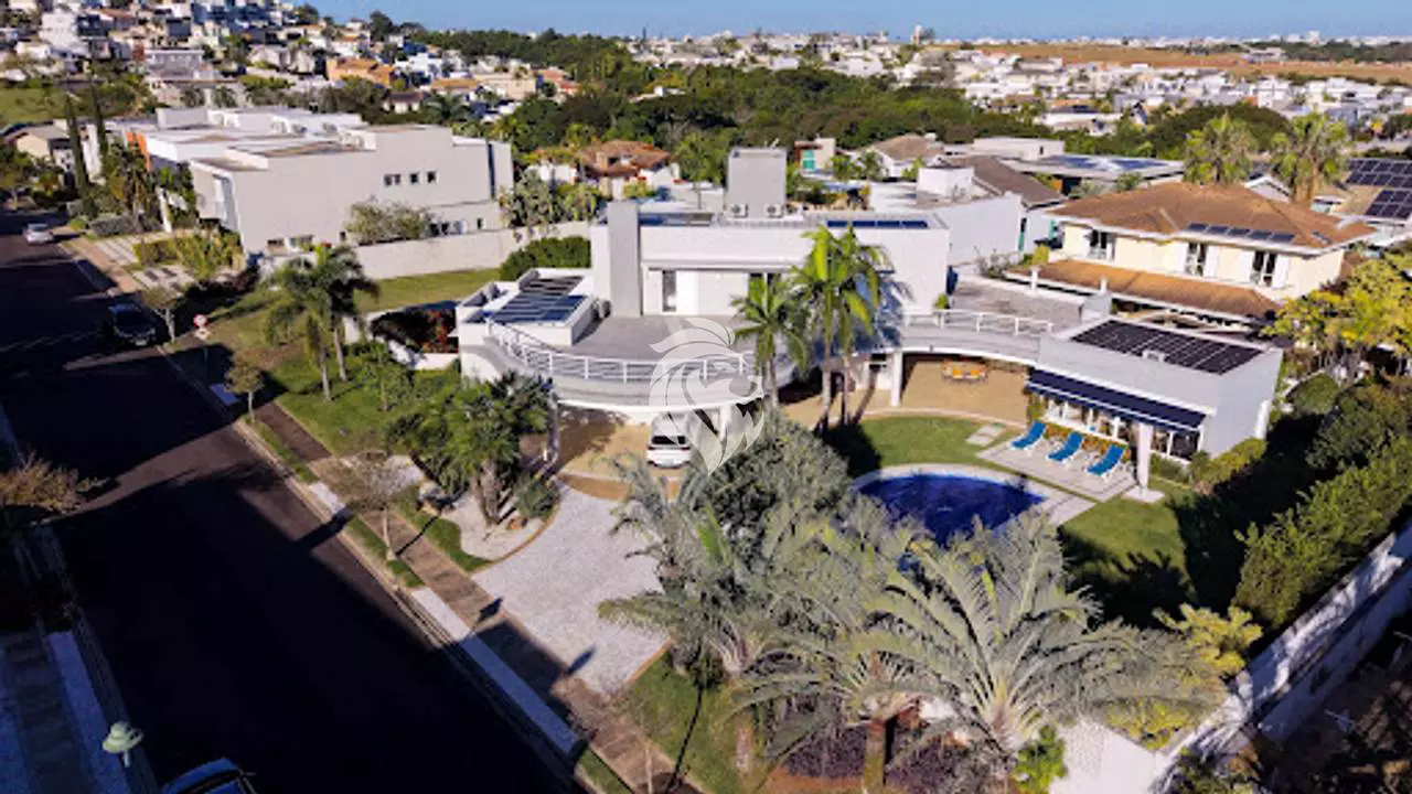 Sobrado de 580 m² com 4 suítes e paisagismo assinado no Jardim Vila Paradiso